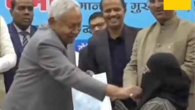 Watch: CM Nitish Kumar pulls down woman’s hijab at event; Cong, RJD slam ‘vile act’ | India News