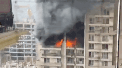Noida high-rise fire: Massive blaze erupts in flat at IVY County Society, panic among residents | Noida News
